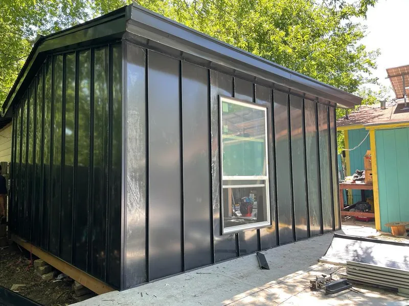 Black standing seam metal wall panels for Roof Inspection in Hudson Falls